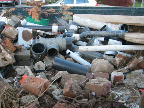 Old pipes in dumpster