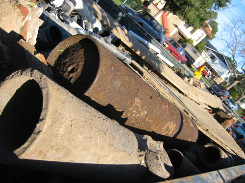 Pipes and water heater in the dumpster