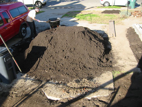 Shovelling compost