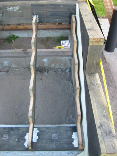 top view of two stringers and piece of siding