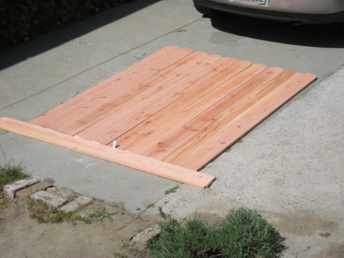 Fence panels laid out on the driveway