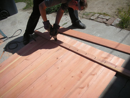 Noel glueing the cross pieces on the panel