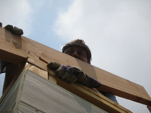 Putting a rafter in place