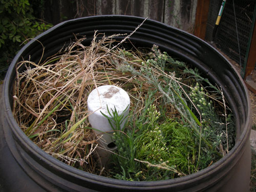 Filled compost tumbler