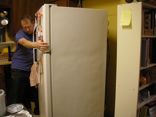 Noel moves the fridge