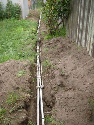 Laying new pipes in the trench