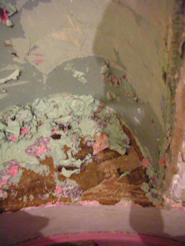 Paint scraps in the bottom of the niche