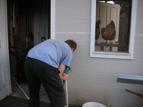 Noel drilling a hole in the wall