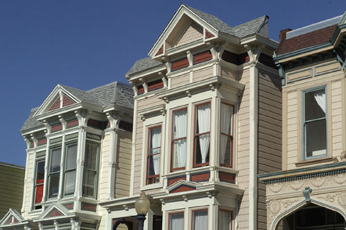 The nearer house has a higher roofline