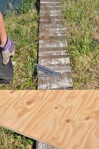 Using a long board and a string to mark off the arch