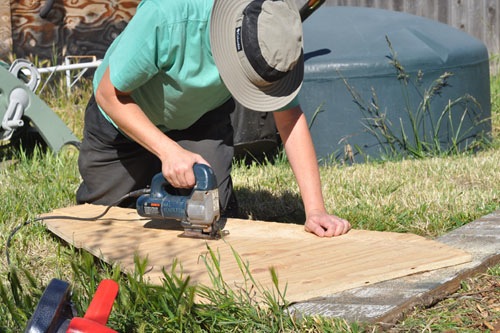 Noel cuts the template with a jigsaw