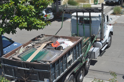 Our last dumpster leaving the house