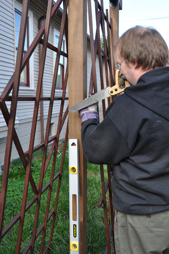 Noel puts trellises on the pergola