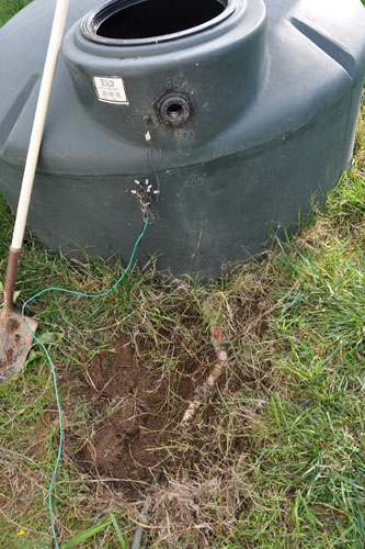 Digging out the tank plumbing