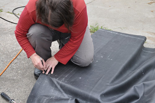 Using a craft knife to cut the liner