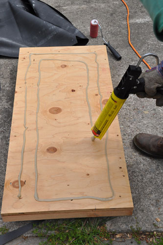 Applying glue to the face of the sleds