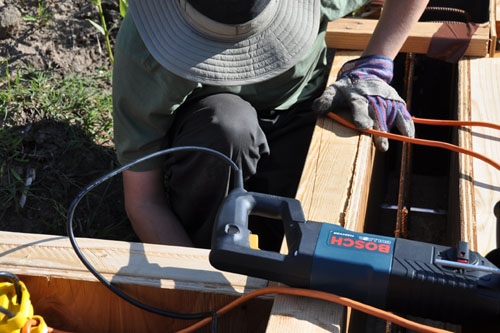 Noel squinched behind the formwork