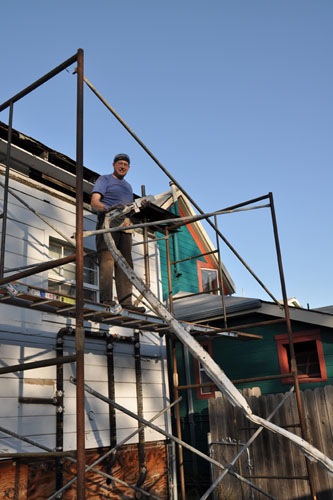 Pulling down the last of the old awning