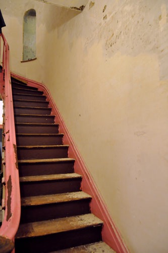 Washing the walls up the stair