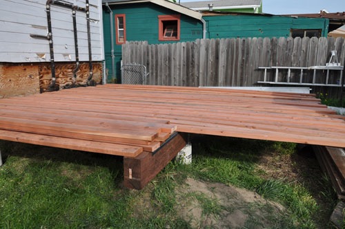 All the lumber moved off the truck to the back yard