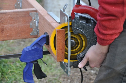 Noel cutting the mitered edges of the stair framing