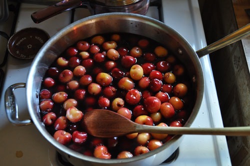 Pitted and simmering in syrup