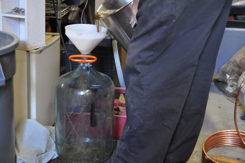 Pouring the wort into a carboy for fermentation
