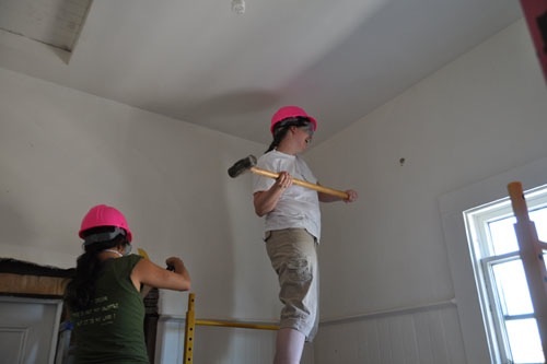 Annette enjoys the sledgehammer in the upstairs bathroom