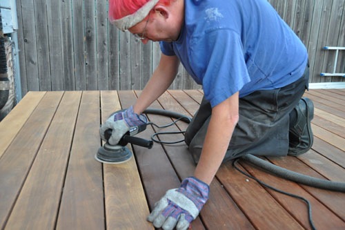 Noel sanding the deck