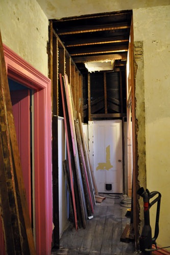 The plaster over the door cut out, and framing removed