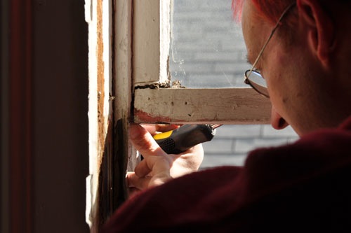 Putting brackets in to hold the window in place