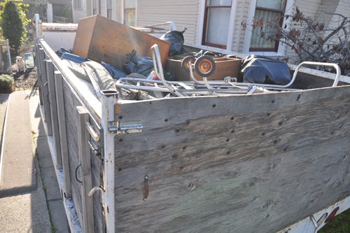 The truck full of stuff for the dump