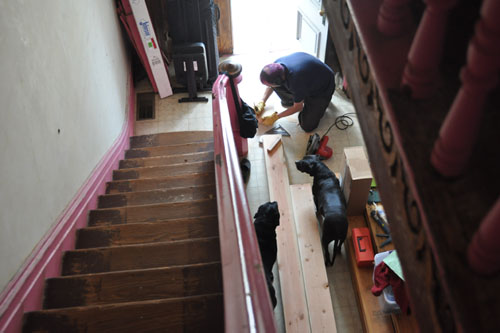 Cutting wood in the front hall