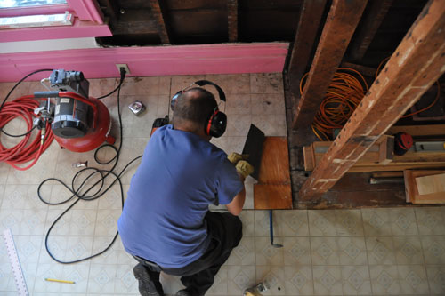 Removing existing floor for the coat closet