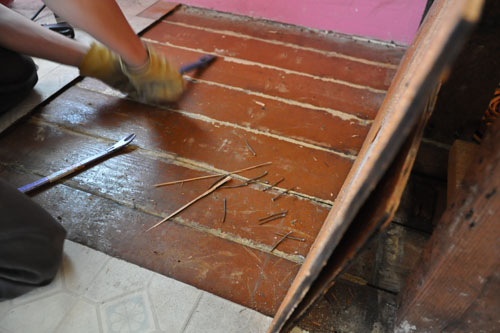 Pulling out nails from the floor