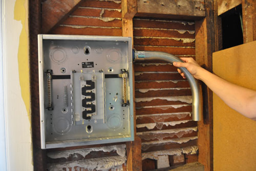 The subpanel in place, plus some conduit