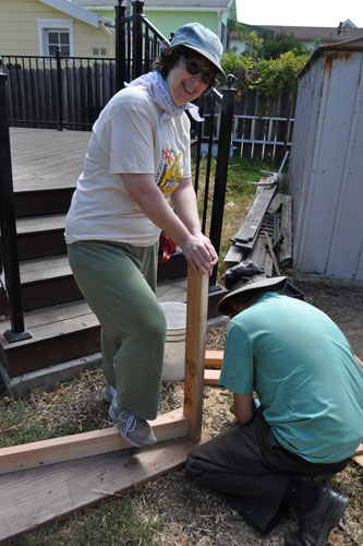 Betsy helping Noel assemble a sawhorse