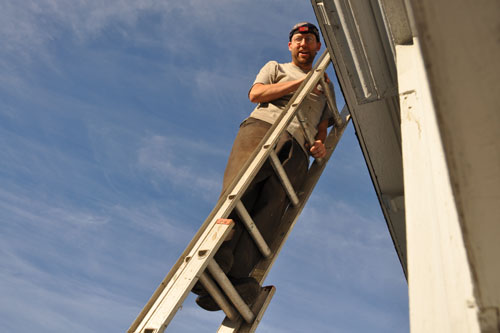 He needed the head lamp to do roof work