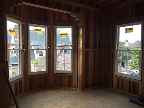 Bay window bedroom with windows