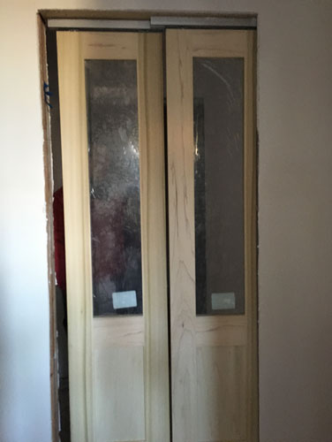 Double-action pocket doors