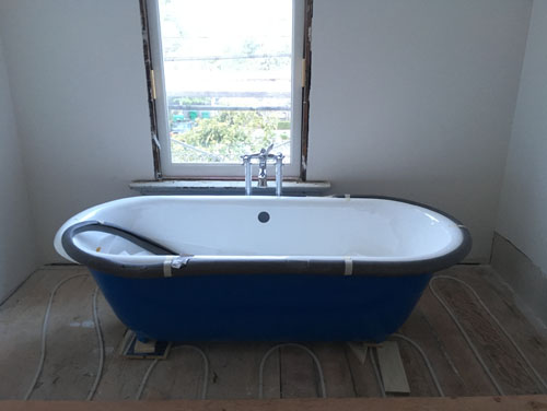 Clawfoot tub in place with shower