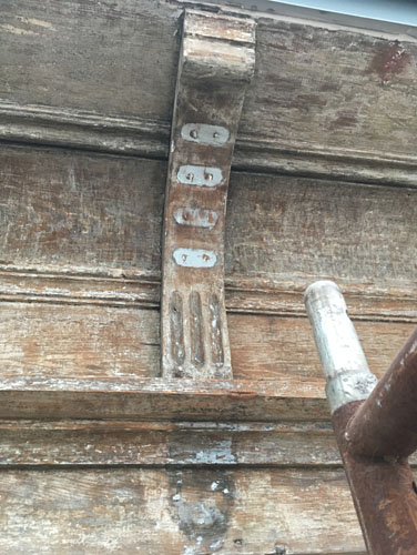 Roof corbels with missing reeds and lozenges